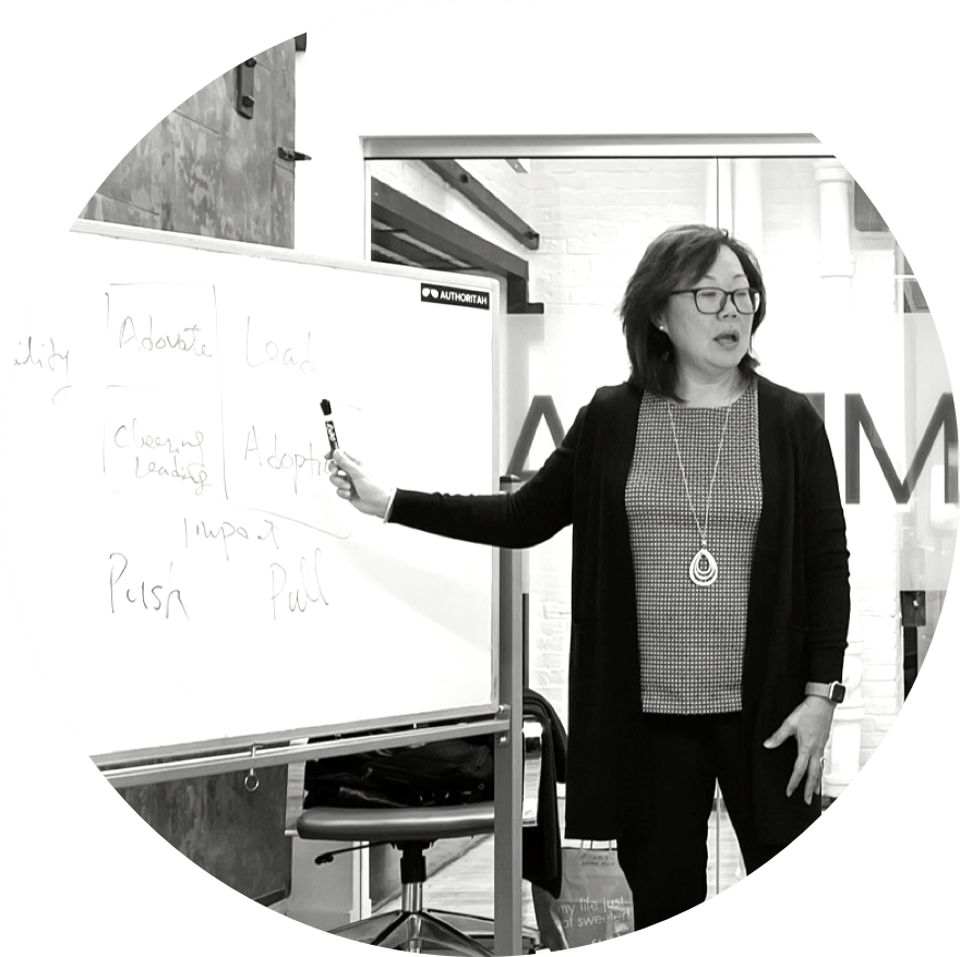 Frances West giving a lecture at a whiteboard